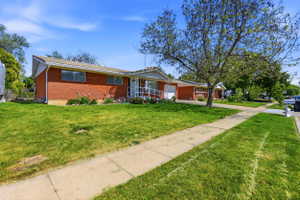Brick ranch-style exterior with a covered front entry