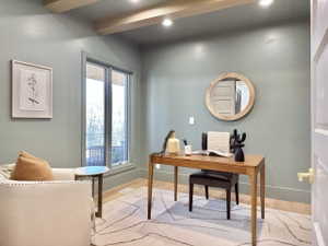 Room featuring light wood-finish flooring and a light green wall color