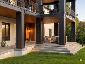 Multi-level exterior featuring concrete steps, white brick facade, and dark framed windows