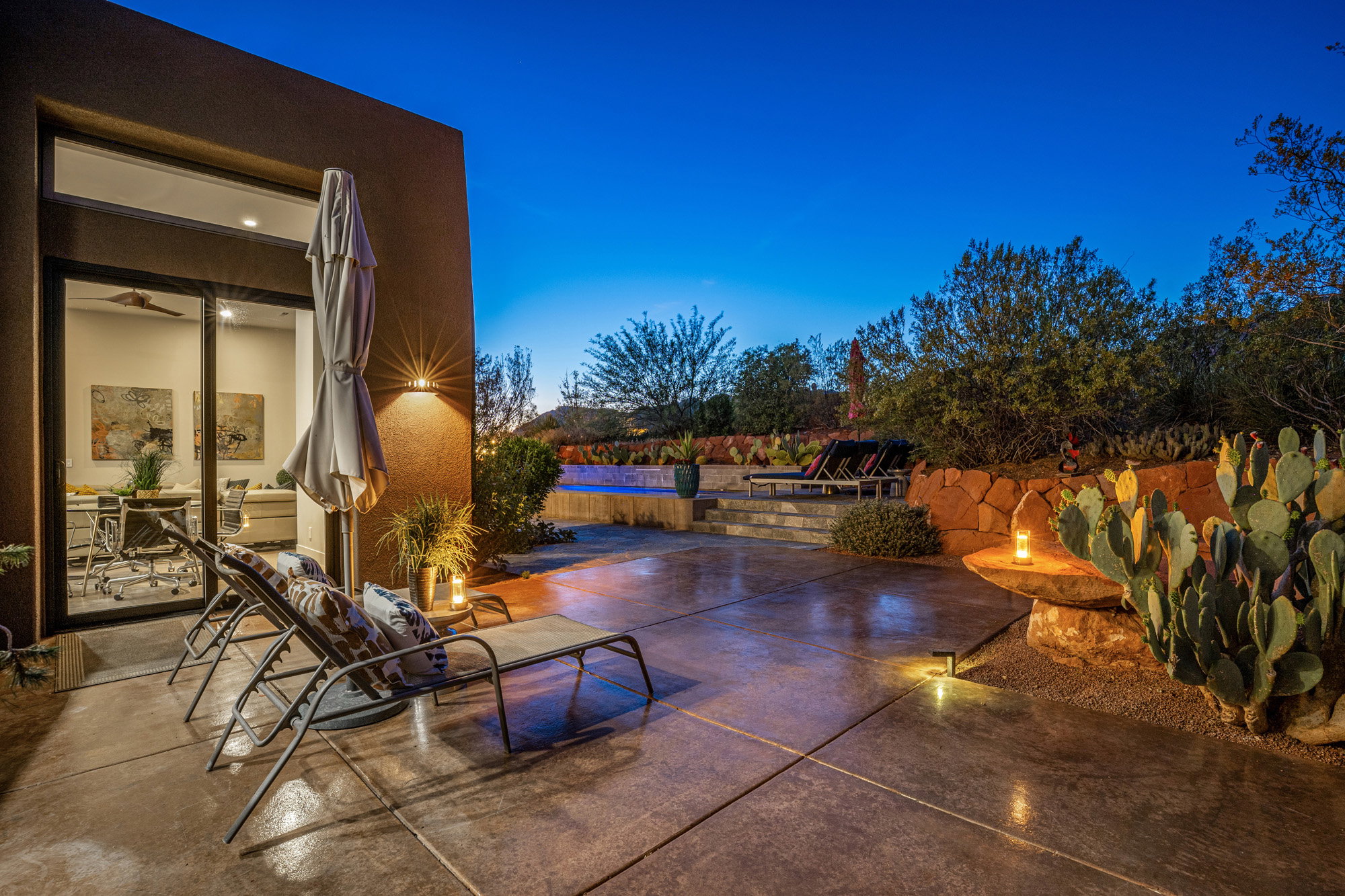 Expansive concrete patio with integrated lighting