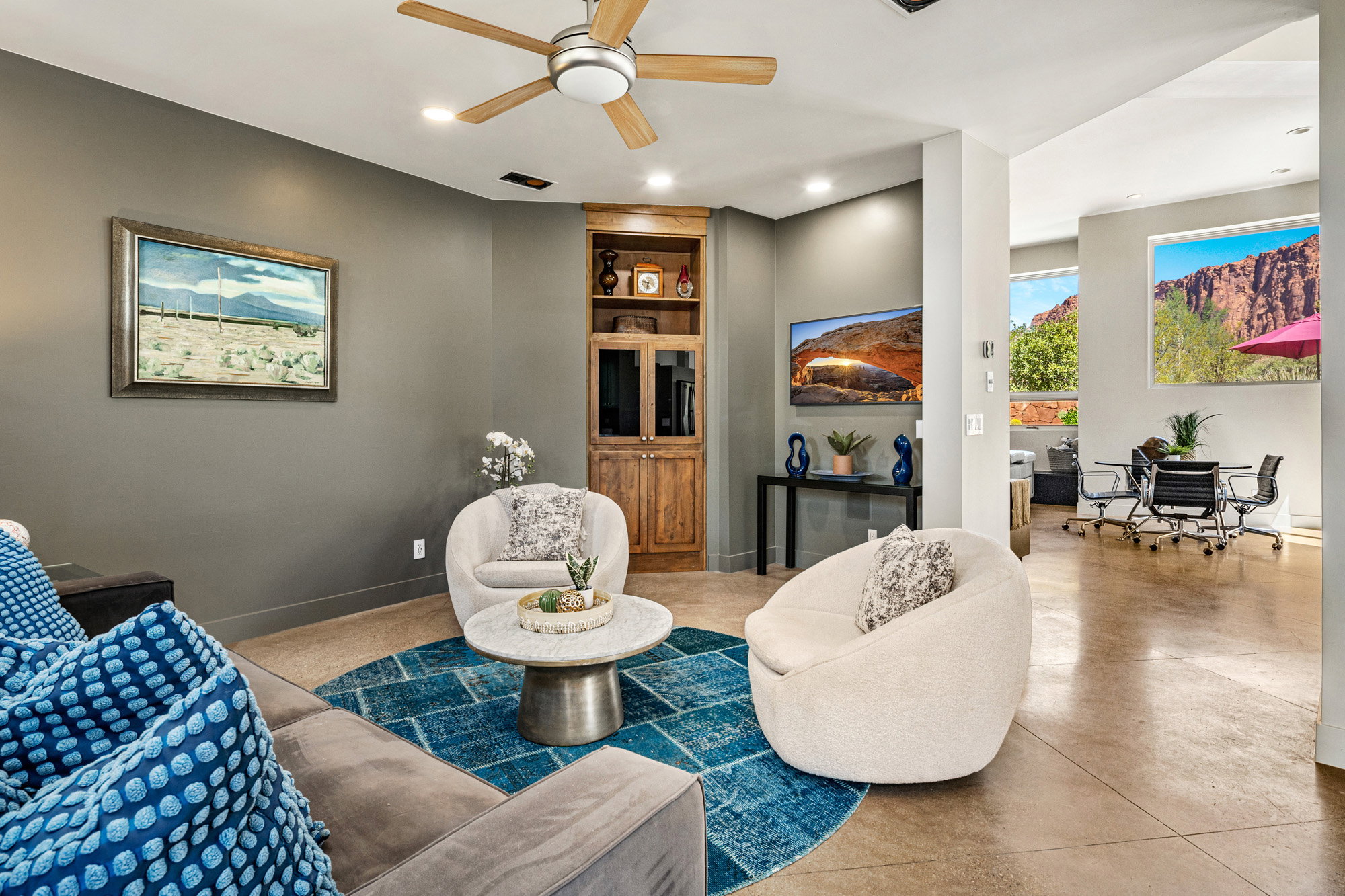 Open-concept living area with high ceilings and recessed lighting