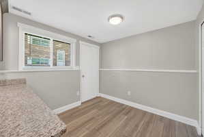 Interior room with light gray walls and white chair rail molding