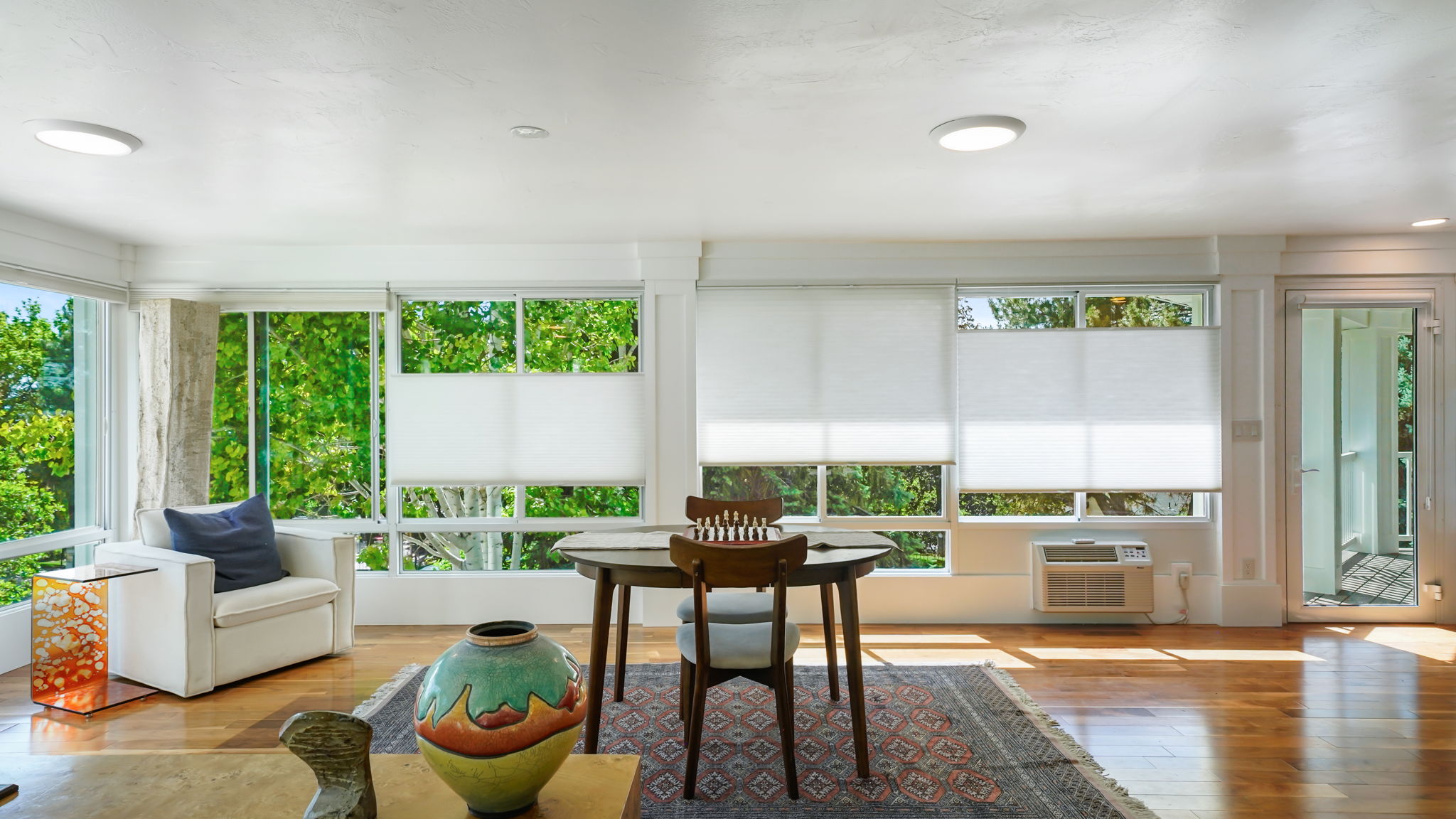 Spacious sunroom/family room with high-end window treatment