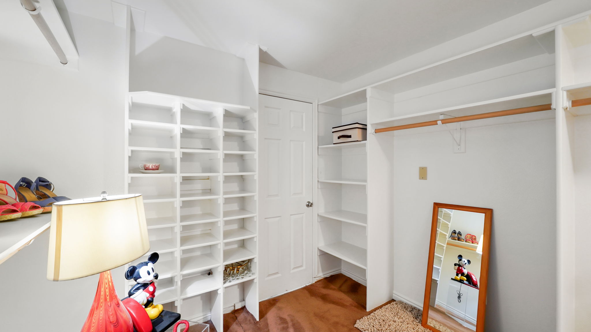 Walk-in closet off of guest room in basement