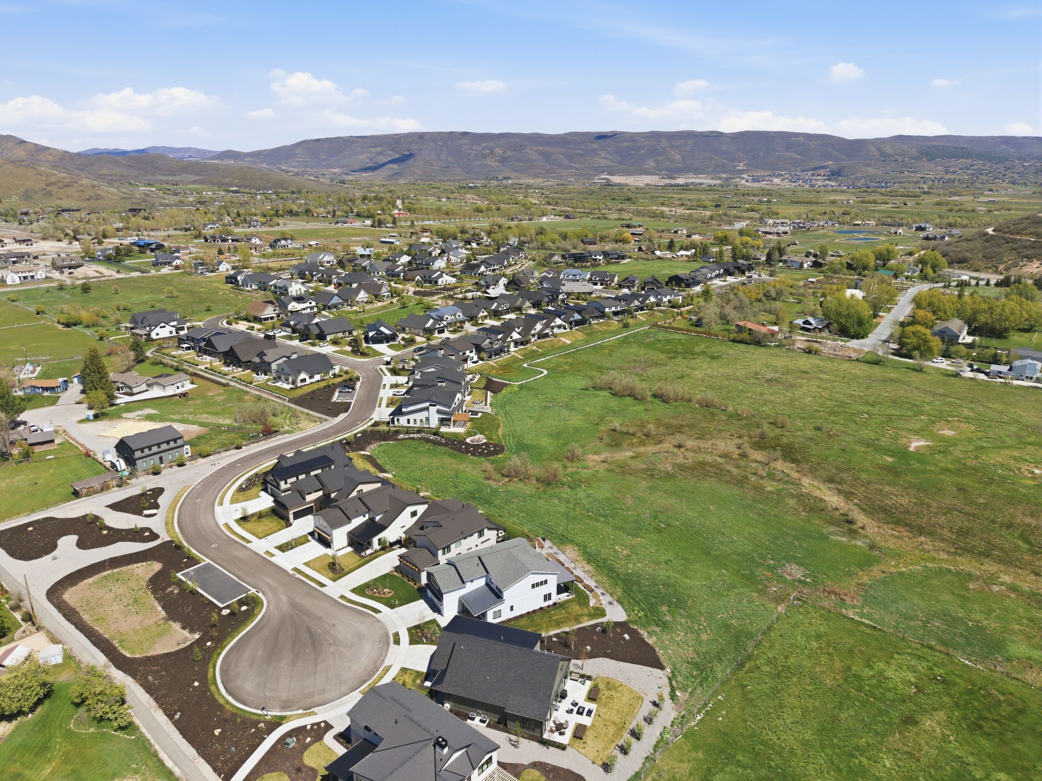 Expansive aerial perspective showcasing a residential community with contemporary homes