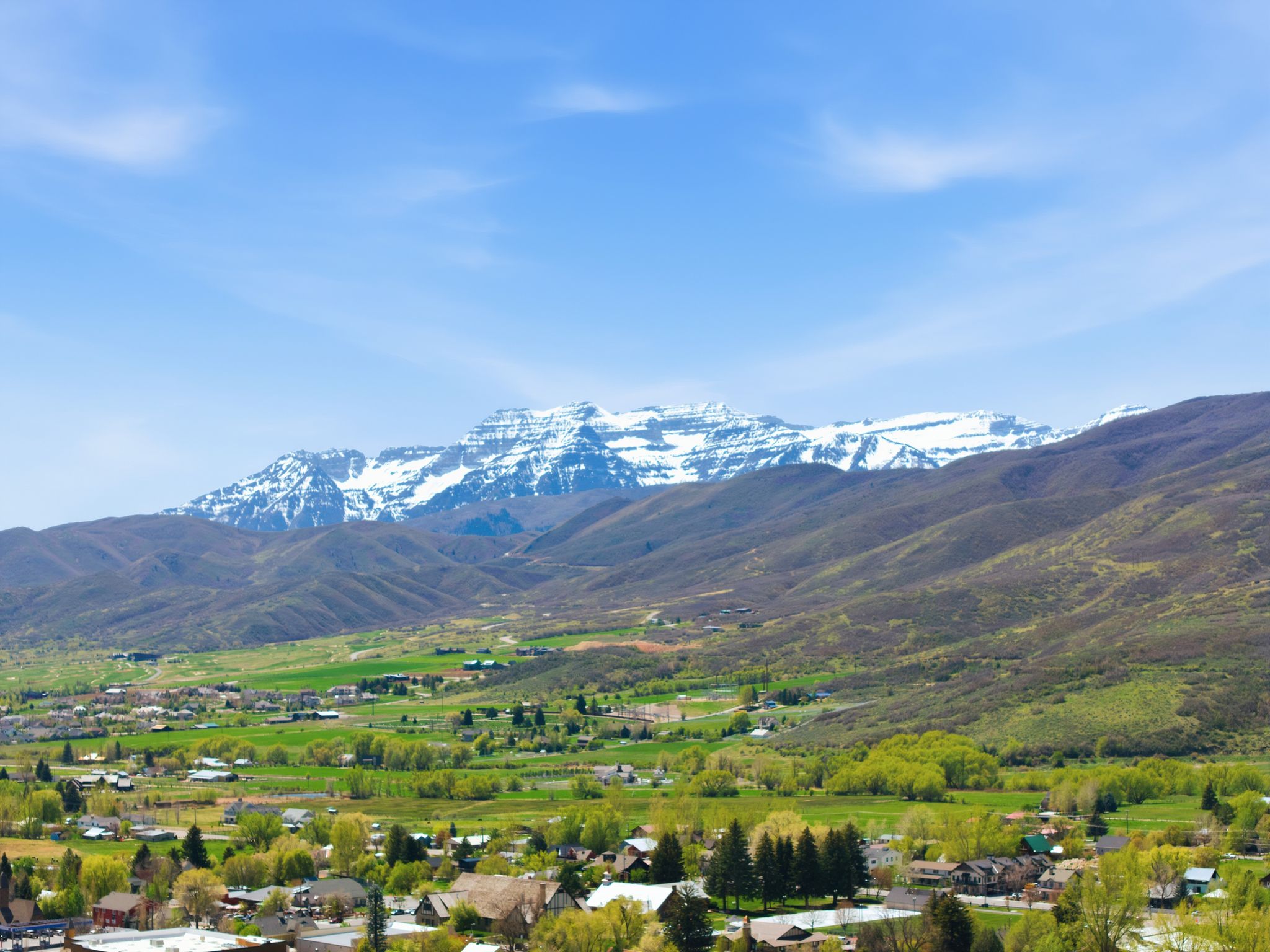 Expansive mountain scenery featuring snow-capped peaks