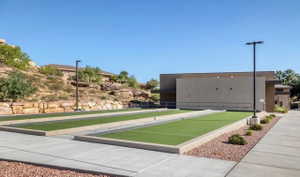 Recreational bocce ball courts featuring synthetic turf surfaces and concrete surrounds