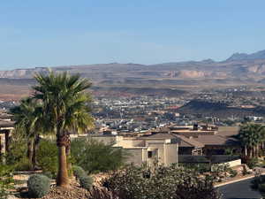 Expansive city panorama with distant mountain ranges