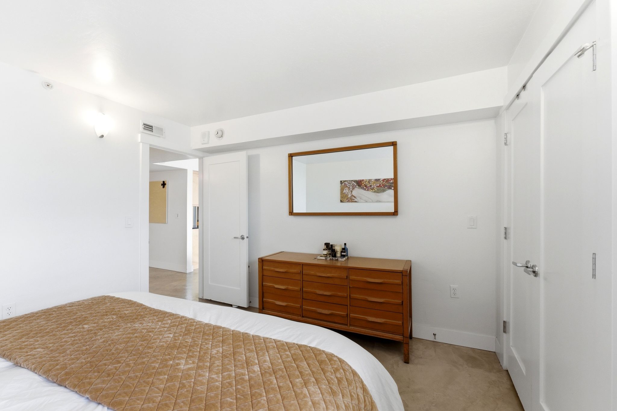 Bright interior room with light-colored flooring and white walls