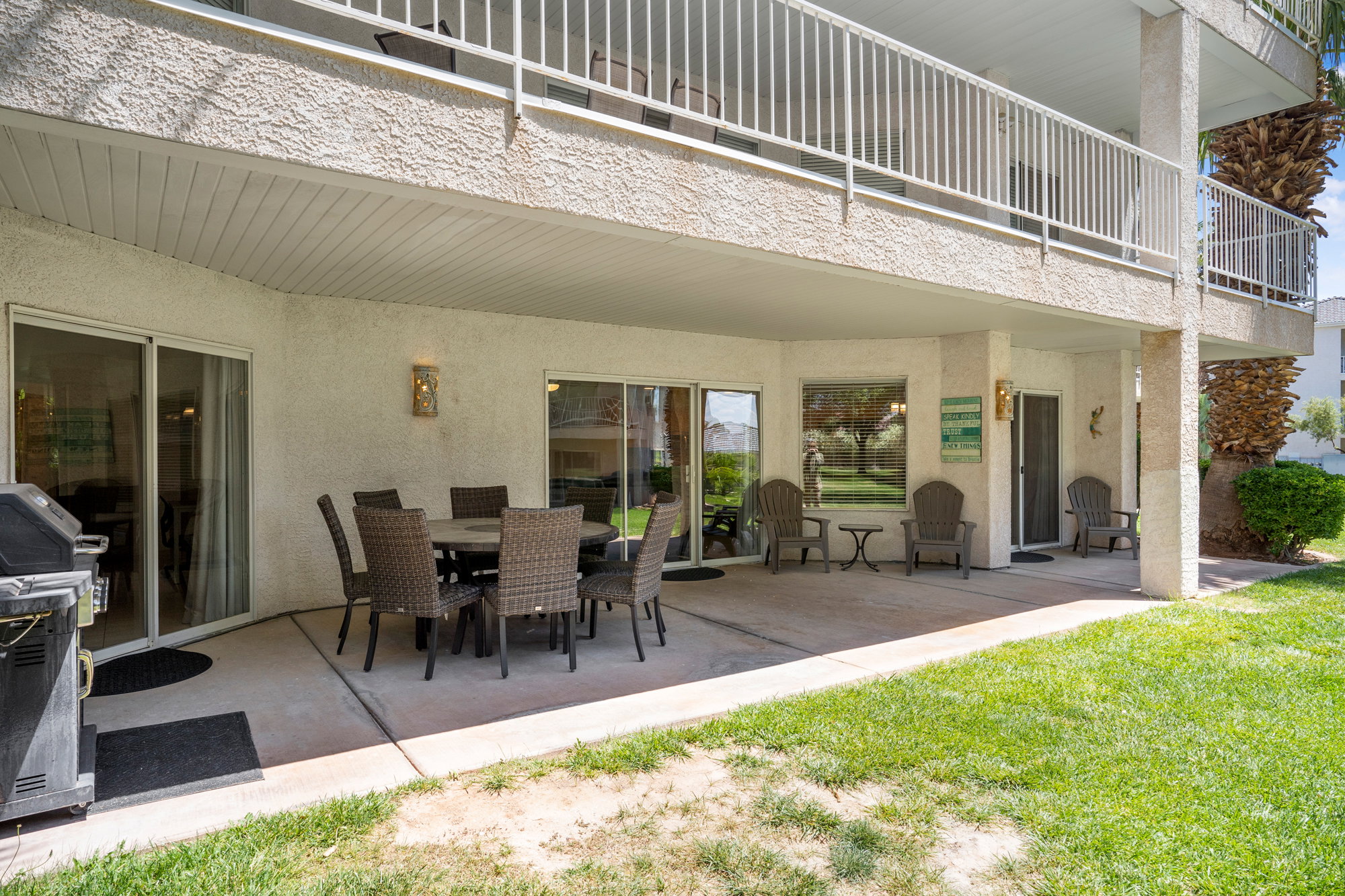 Ground-level covered patio with concrete flooring