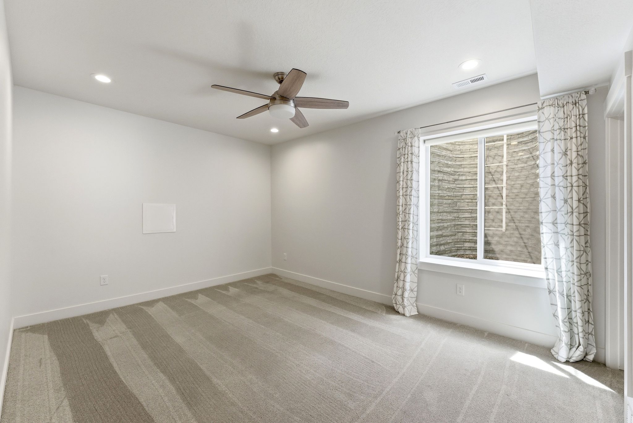Neutral carpeting with subtle stripe pattern