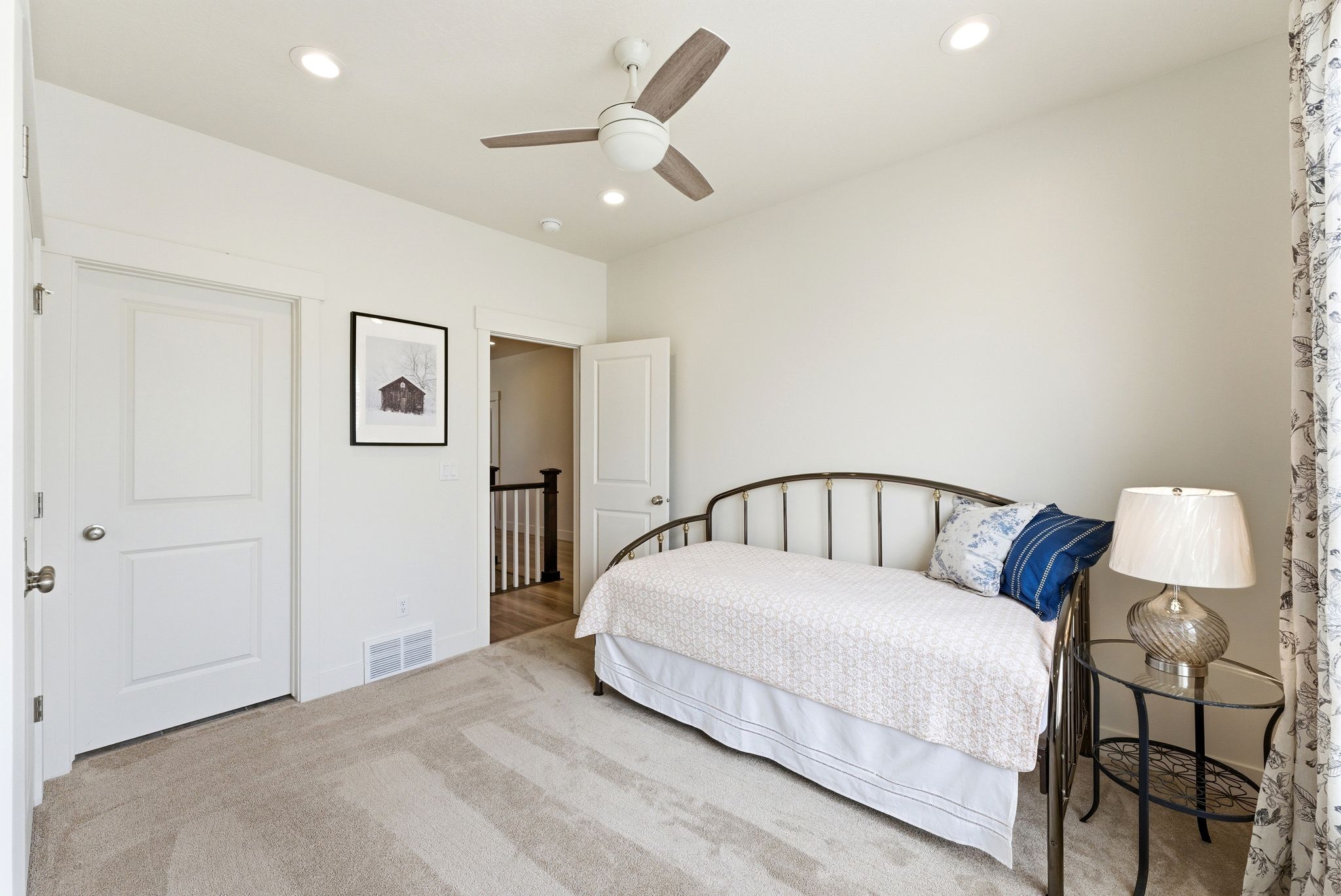 Carpeted room with recessed lighting and a ceiling fan