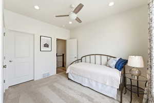 Carpeted room with recessed lighting and a ceiling fan