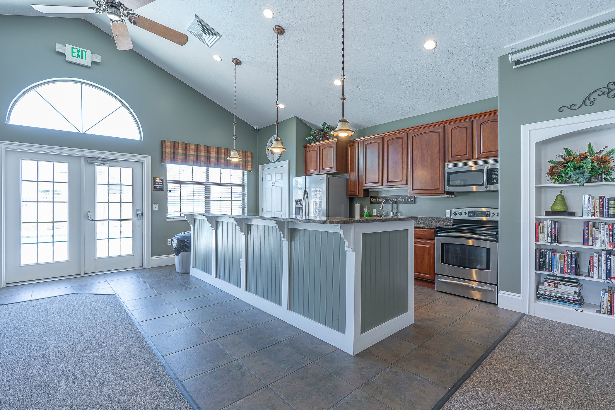 Vaulted ceilings featuring a ceiling fan and recessed lighting