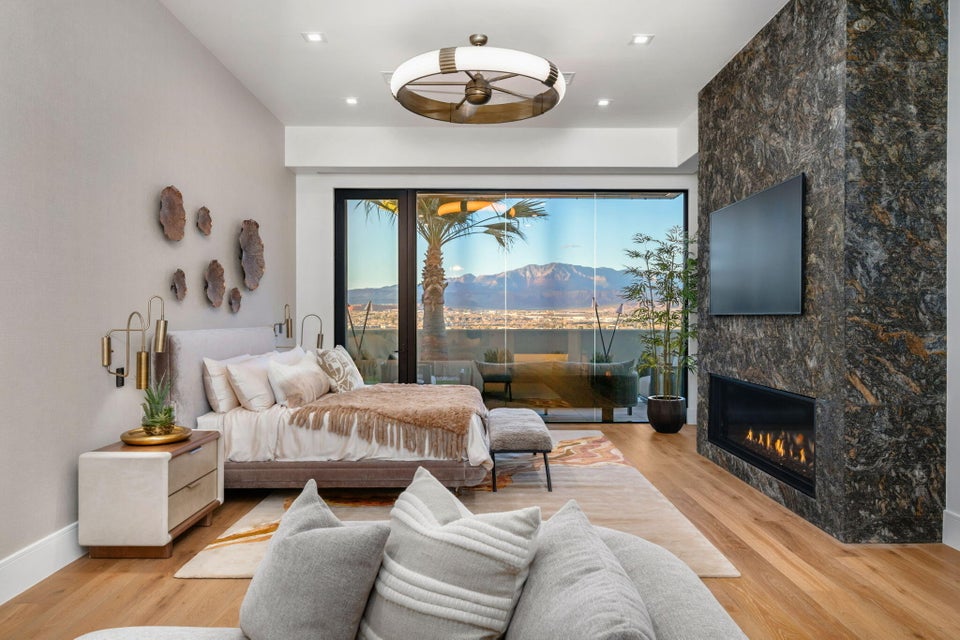 Expansive floor-to-ceiling sliding glass doors open to an outdoor space