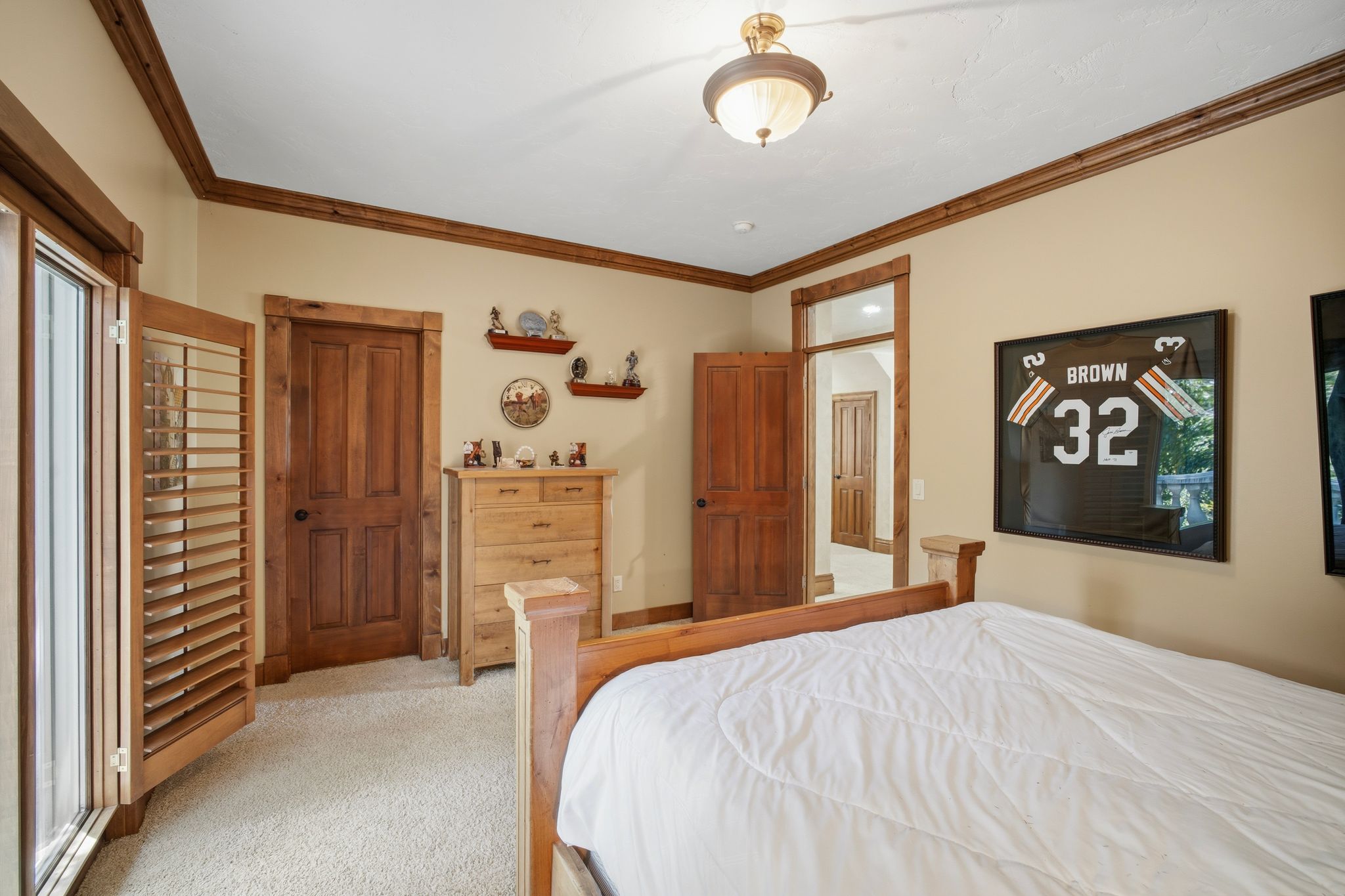 Room featuring wood-finish doors and trim