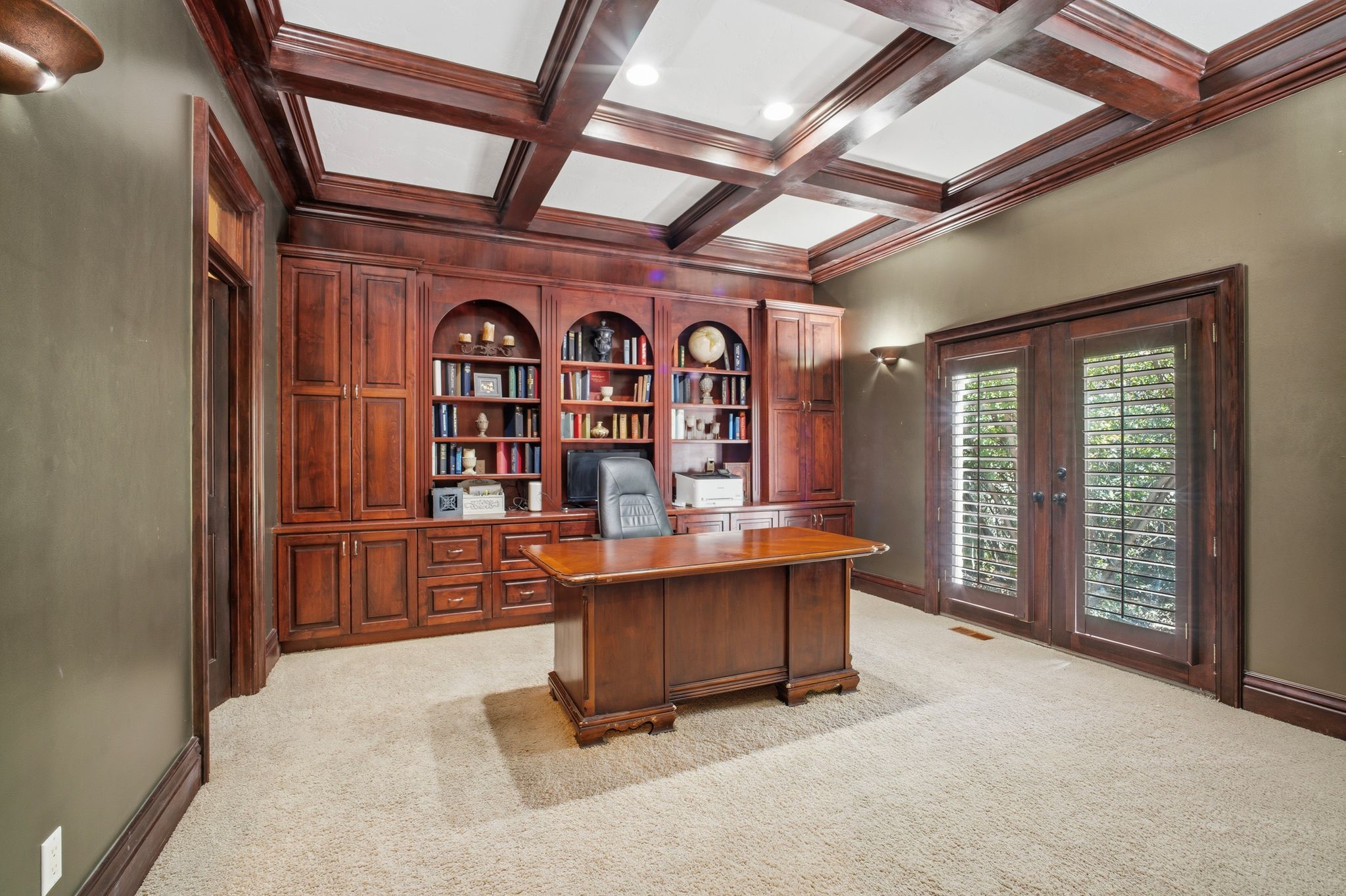 Built-in wood cabinetry with integrated shelving and desk area