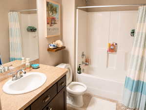 Bathroom featuring a built-in tub and shower combination with a chrome shower head and faucet