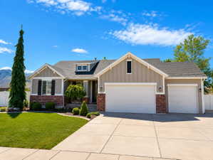 Ranch-style exterior with a partial brick facade and horizontal siding