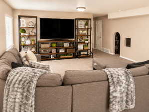 Inviting living area featuring plush carpeting and a neutral color palette