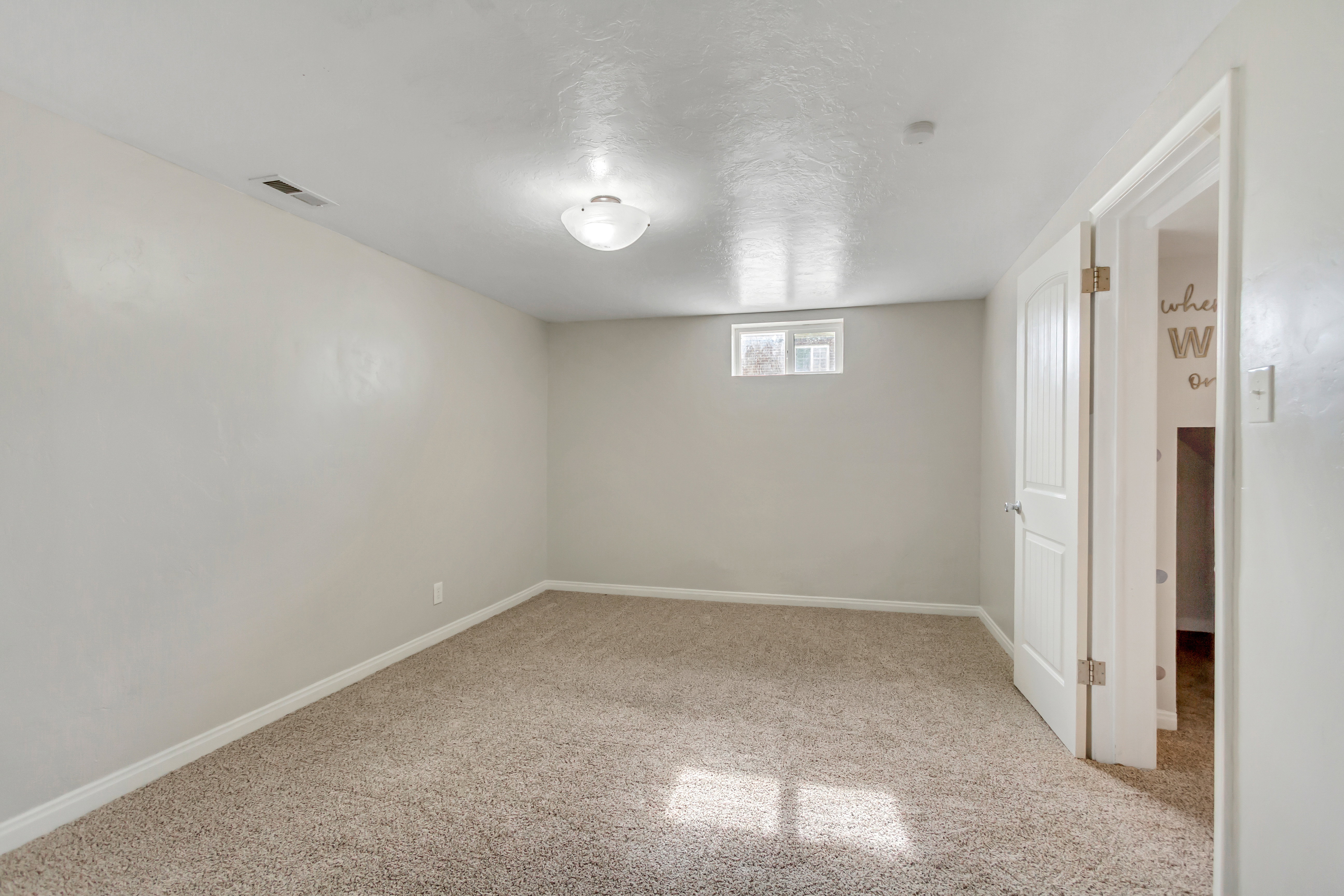 Neutral-toned carpeting paired with light walls