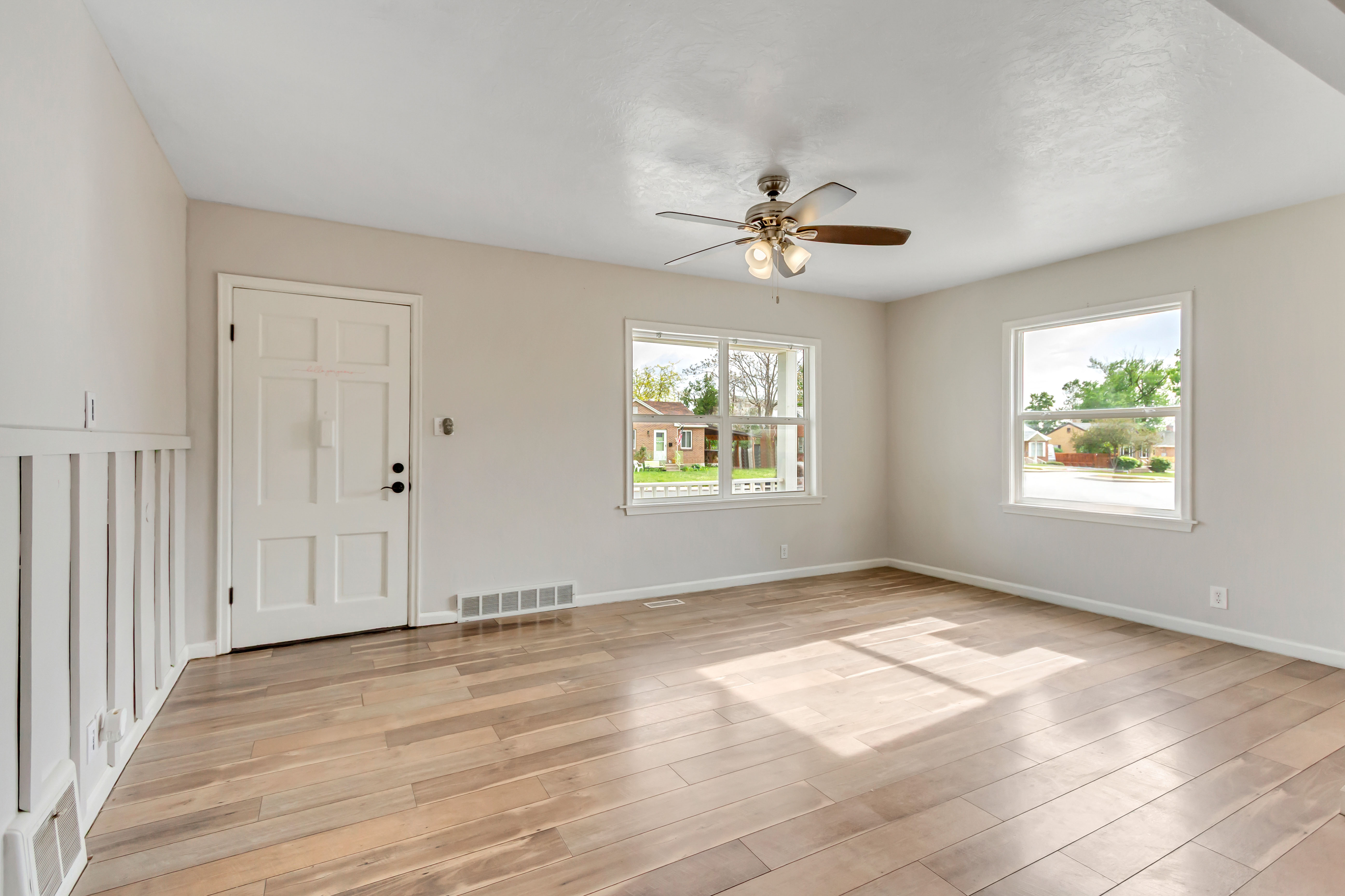 Light wood-finish flooring with neutral wall paint throughout