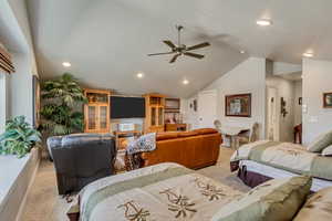 Vaulted ceiling featuring recessed lighting and a ceiling fan