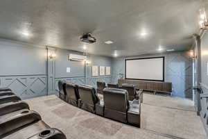 Dedicated home theater featuring a large projection screen, built-in projector, and tiered seating with individual recliners