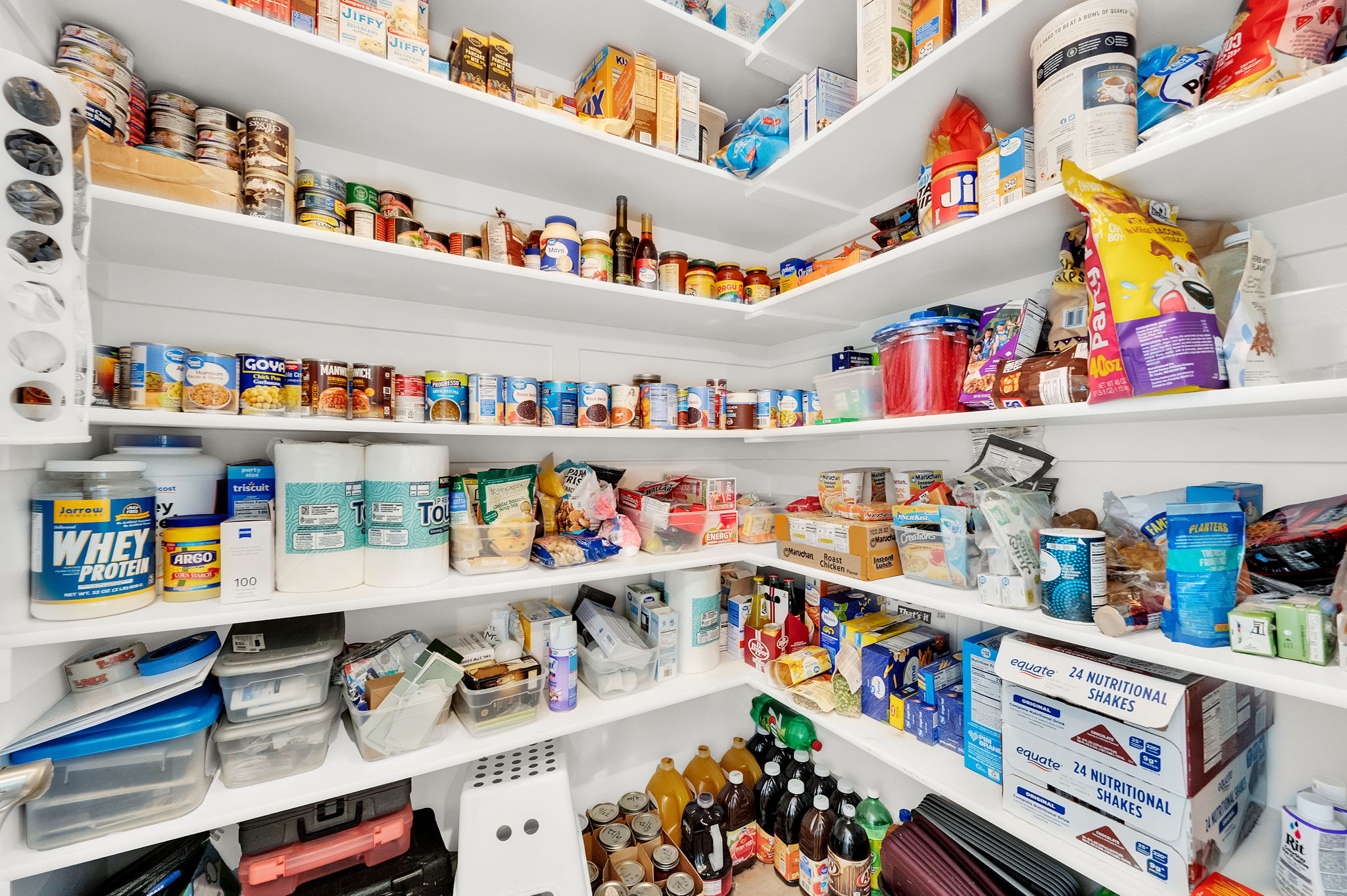 Built-in pantry shelving provides extensive storage capacity