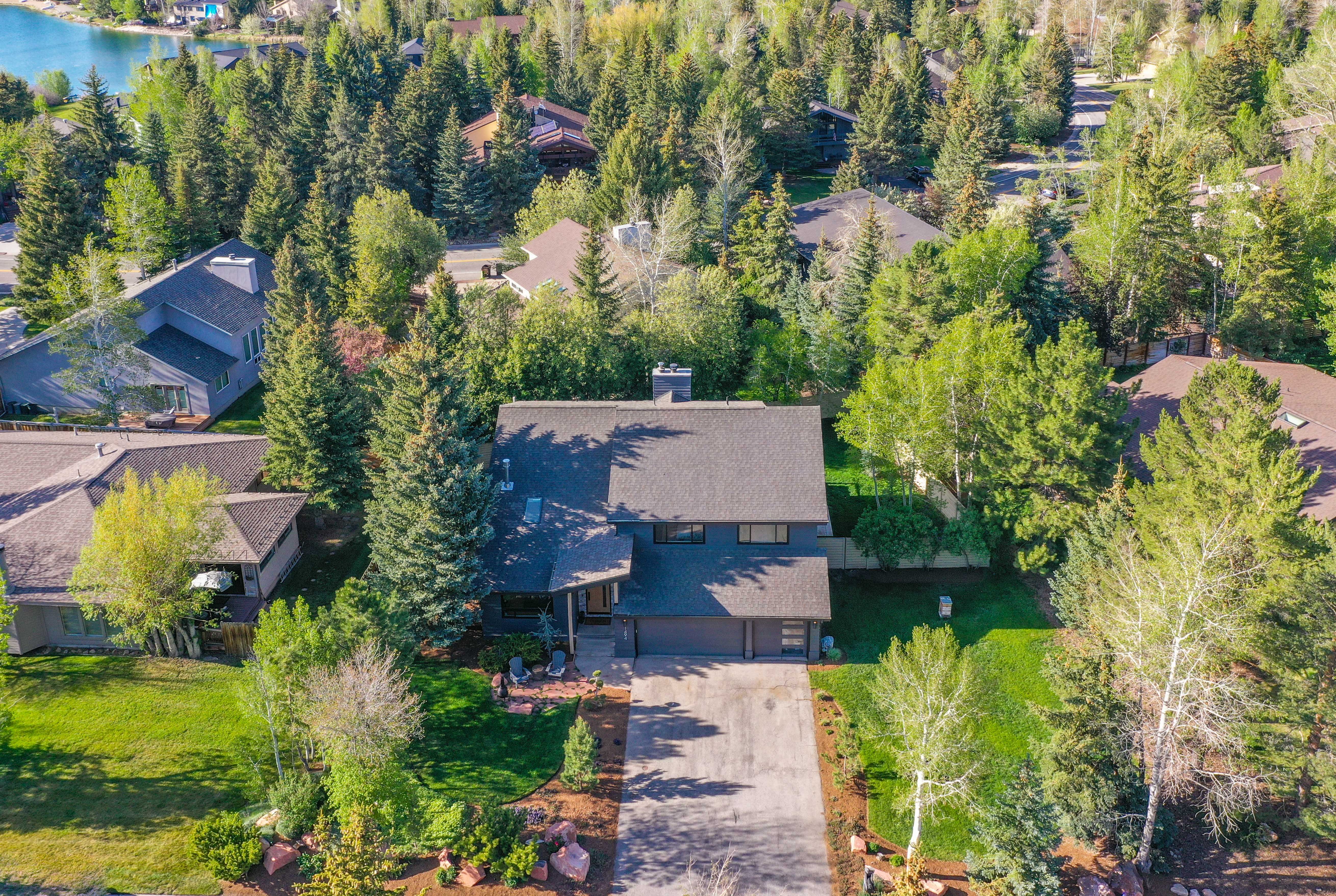Contemporary style residence with a dark gray exterior and a multi-level roofline