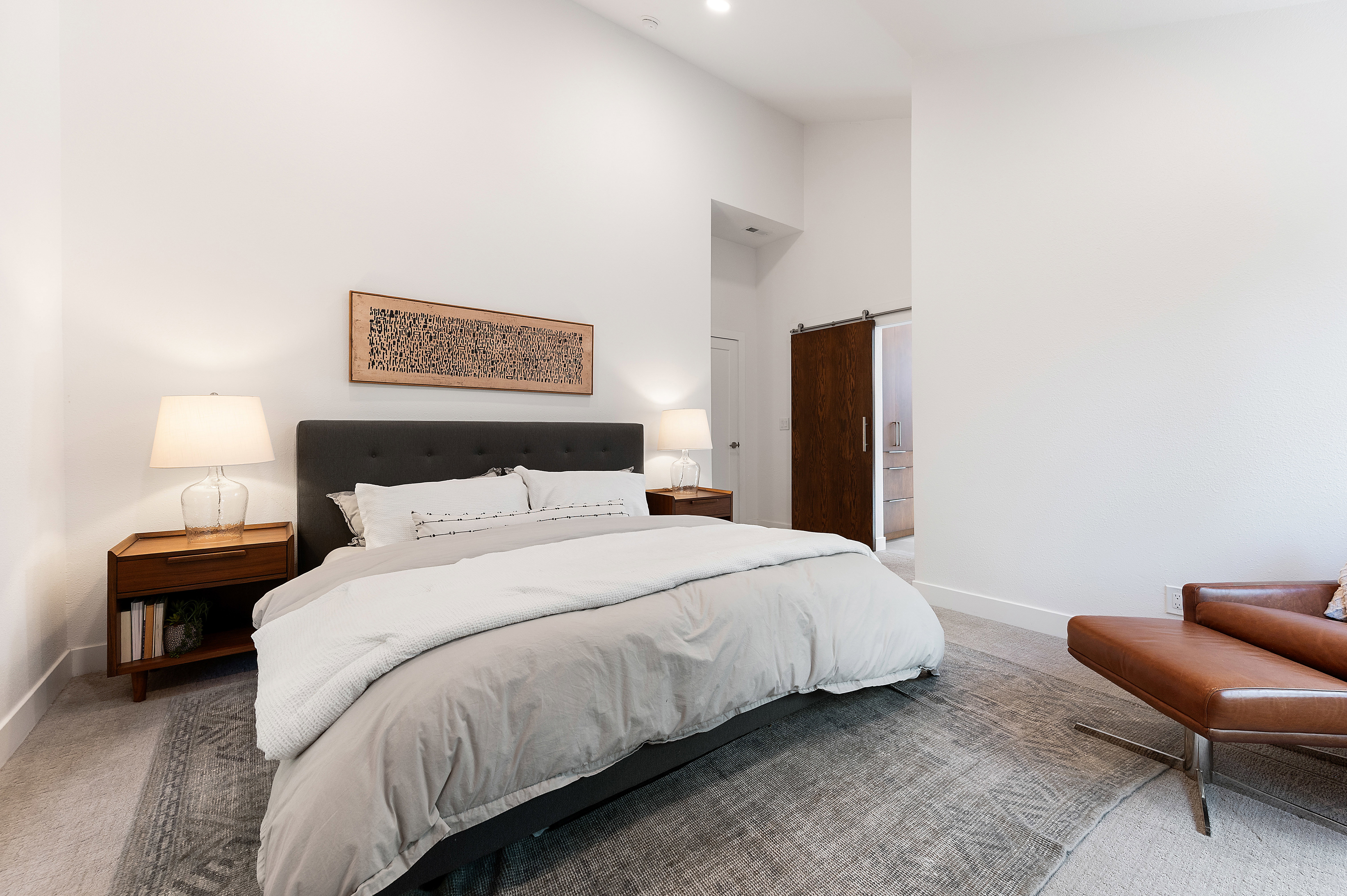 Bedroom featuring vaulted ceilings, recessed lighting, and carpeted flooring