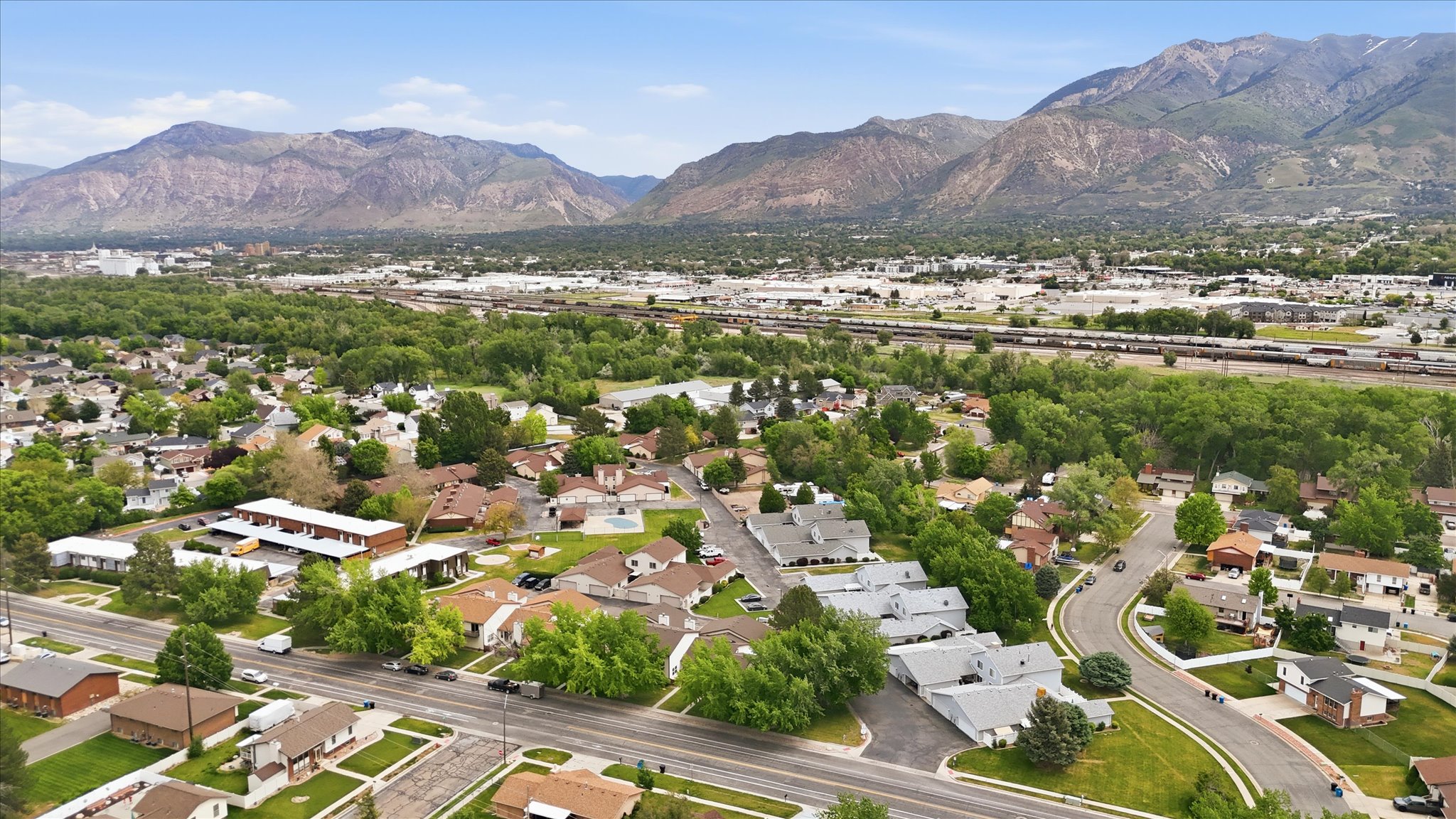 Expansive aerial showcasing a residential neighborhood with varied architectural styles