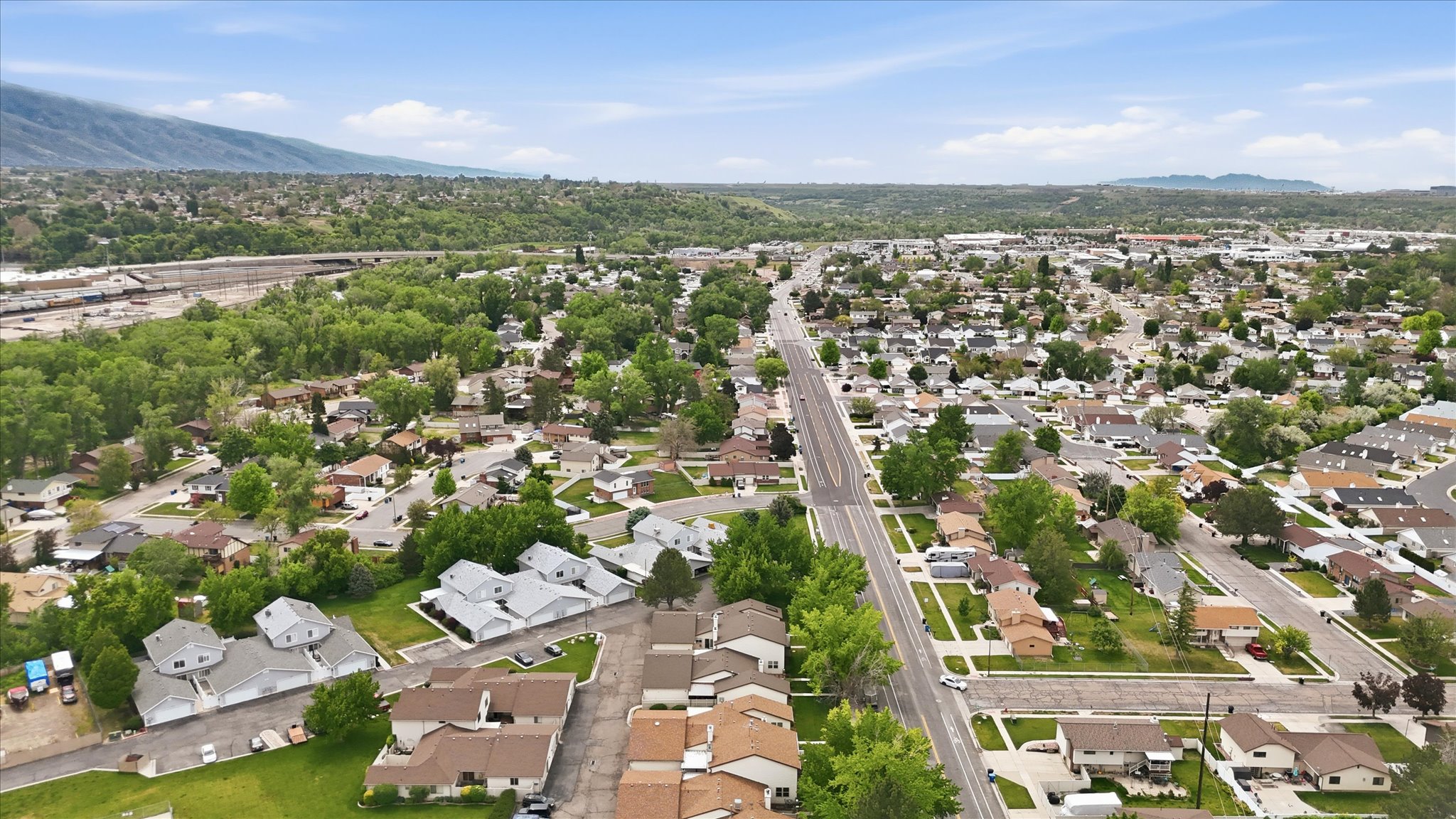 Expansive residential area with a prominent paved thoroughfare