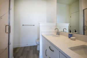 White vanity with dual integrated sinks and light-toned solid surface countertops