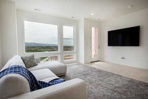 Expansive window wall with mountain and landscape scenery