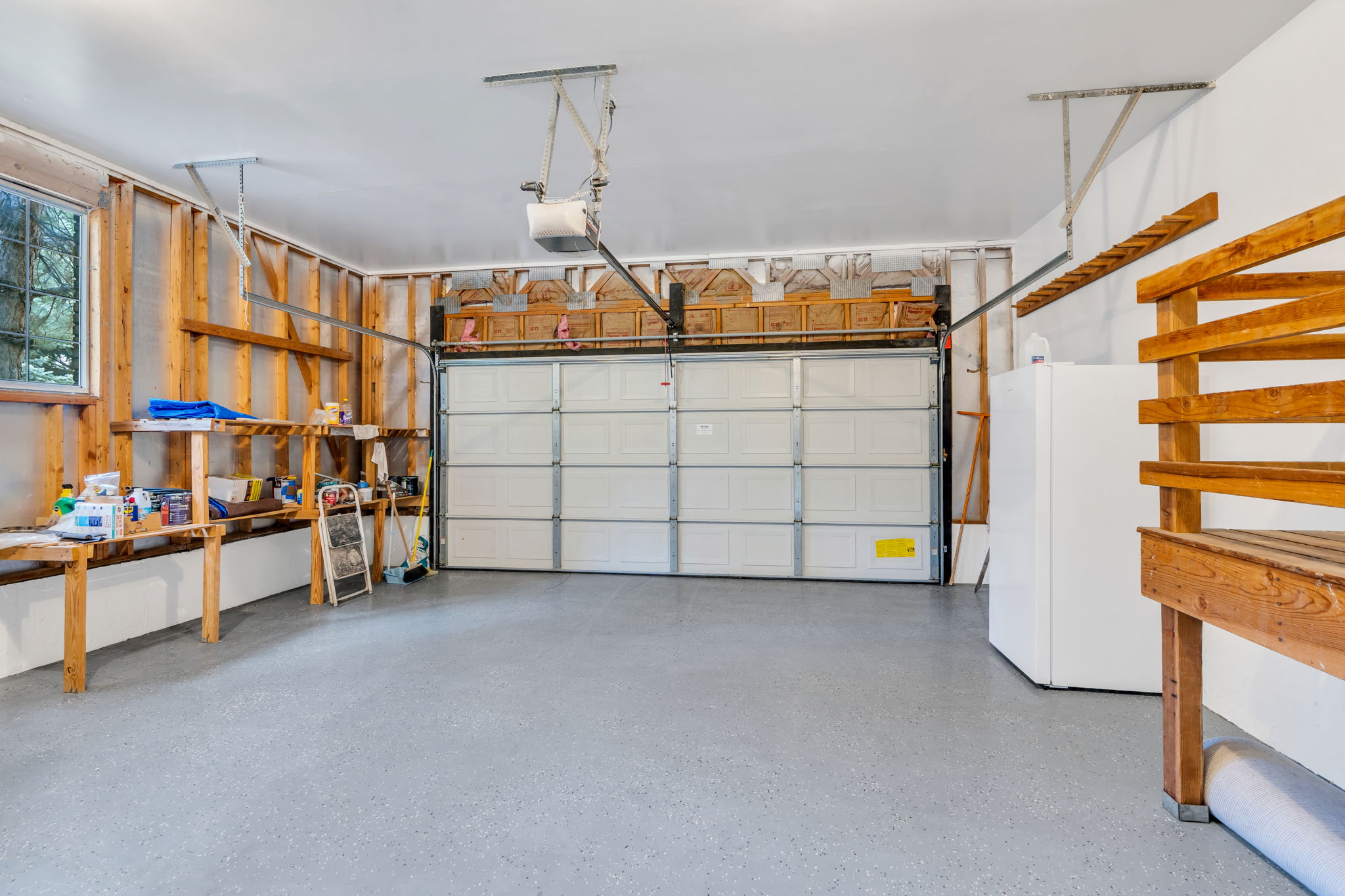 Two-car garage with extra storage and workshop area
