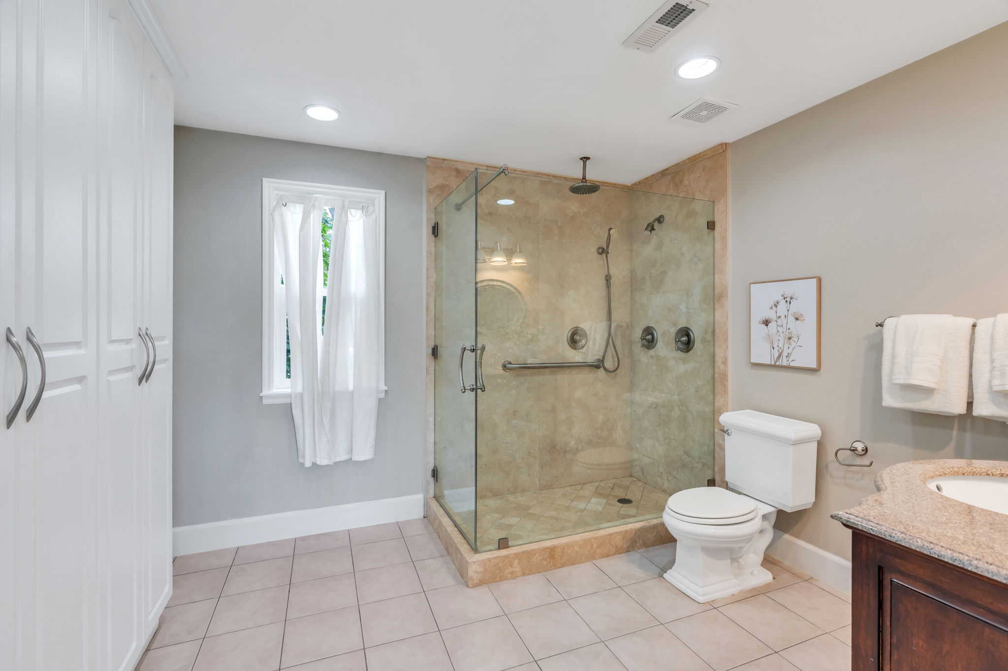 Large walk-in shower with Euro-glass doors