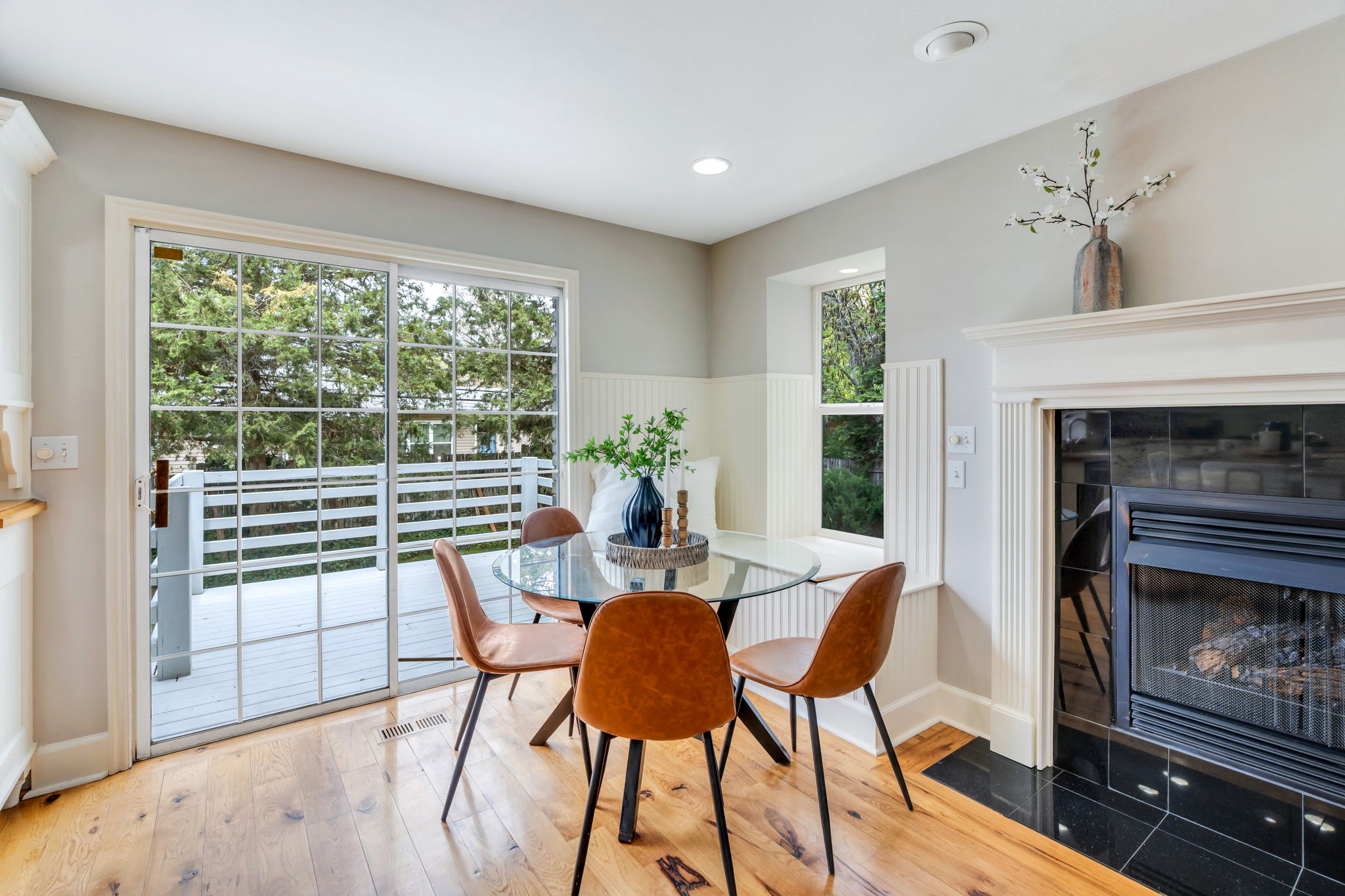 Glass door to outside deck creates a great entertaining space