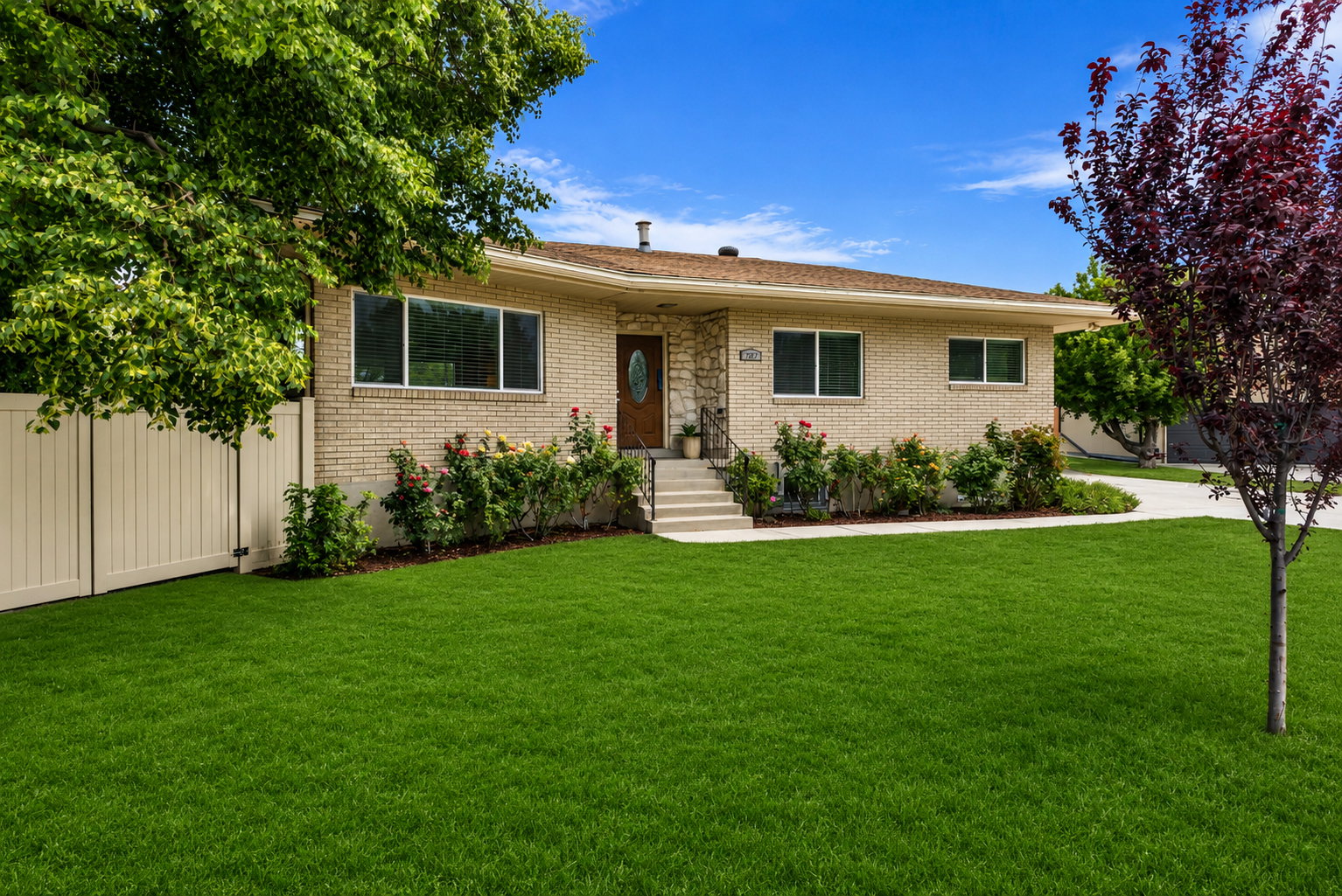 Traditional brick residence with a neatly manicured lawn