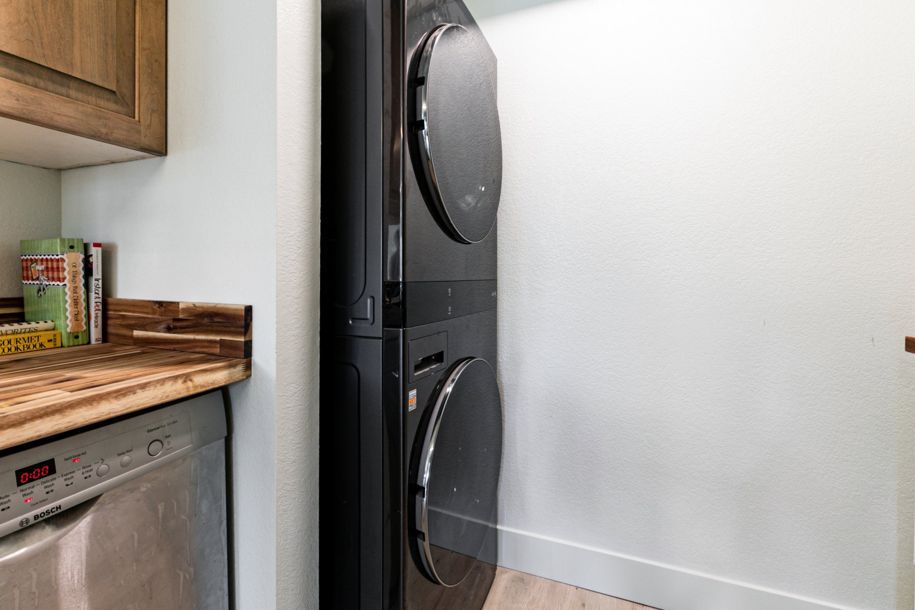 Stacked black laundry appliances