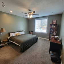 Spacious room featuring carpeting, a ceiling fan with integrated lighting, and recessed ceiling lights