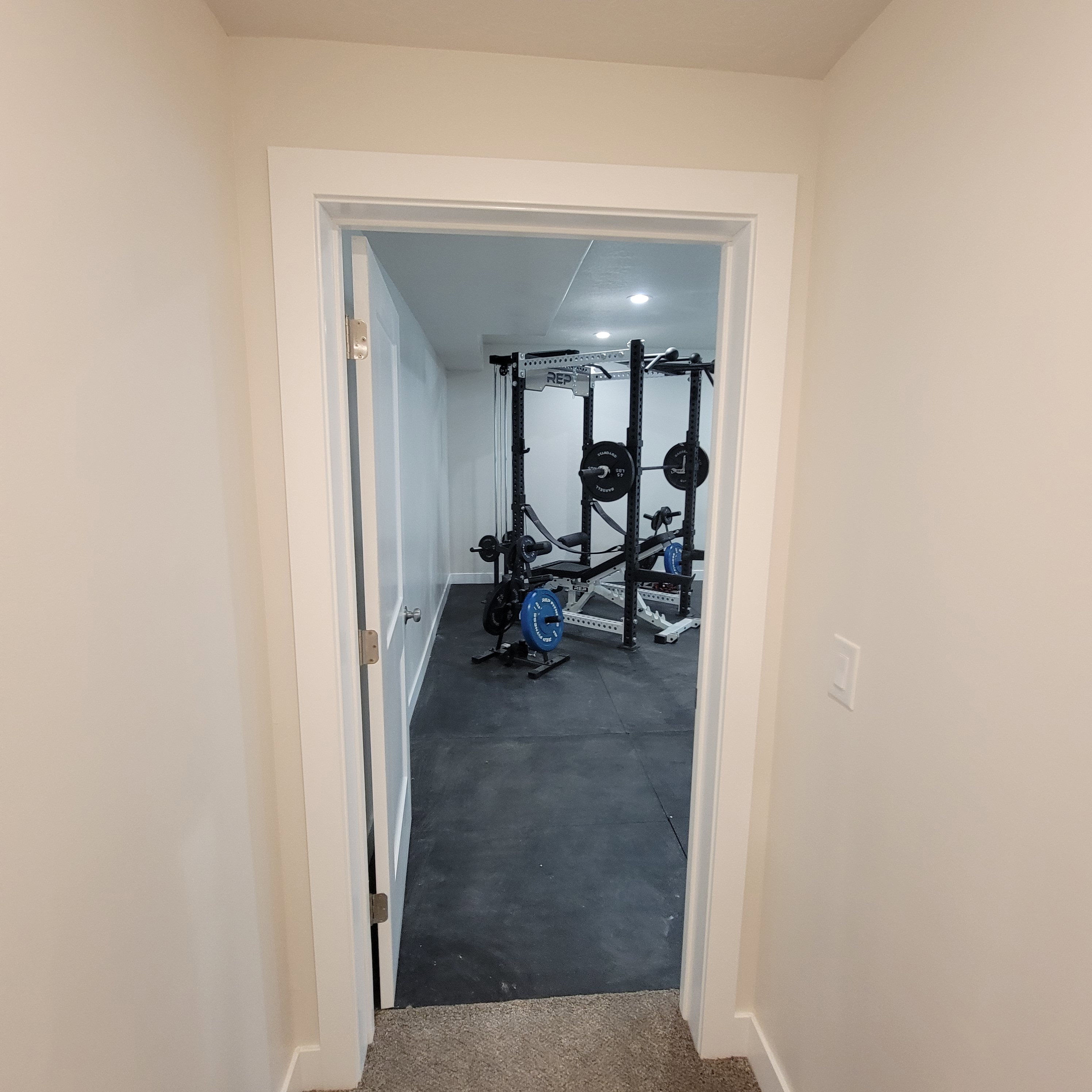 Dedicated room featuring recessed lighting and durable rubber flooring