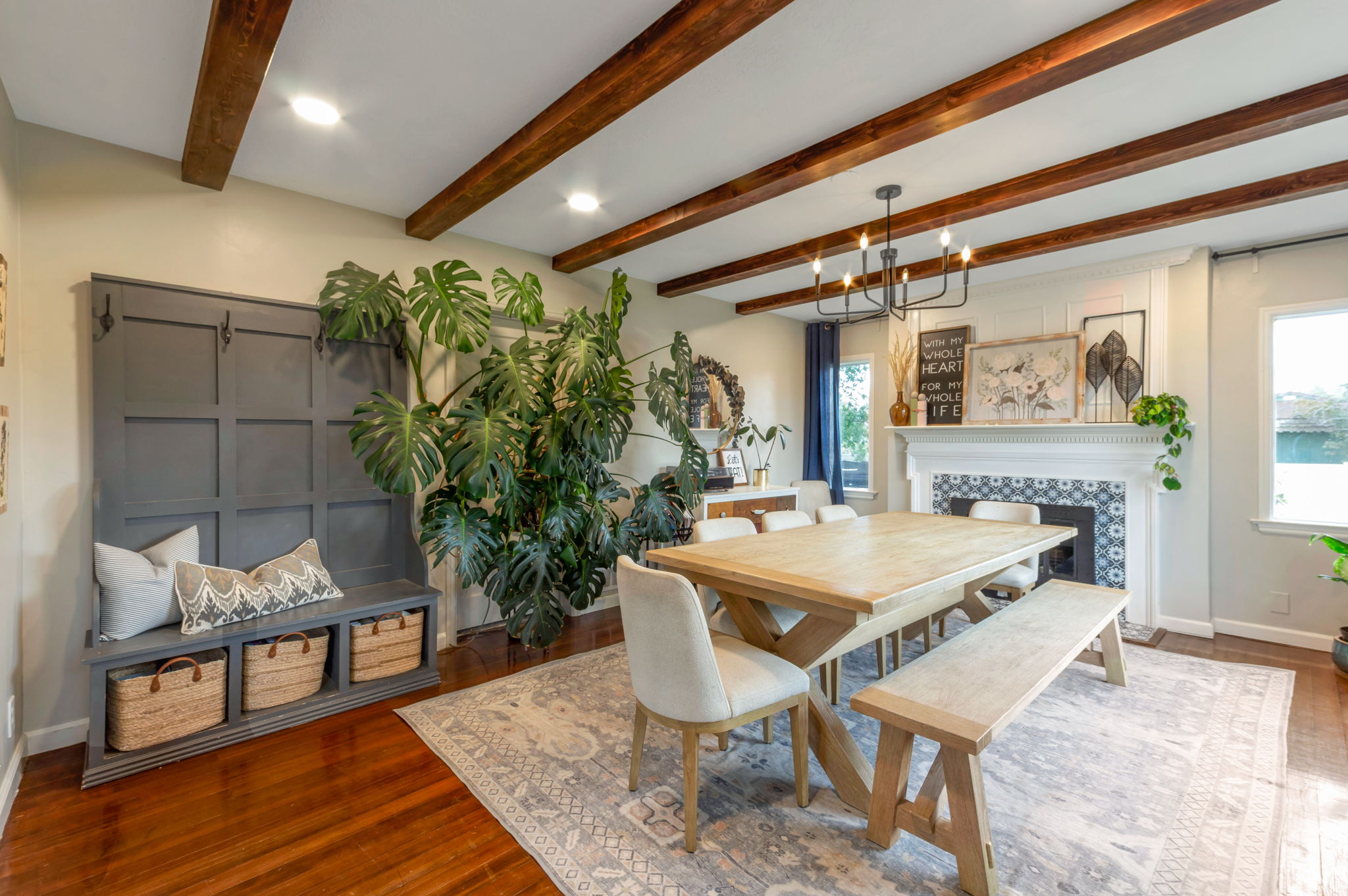 Dining area featuring wood-finish flooring, exposed wood ceiling beams, and recessed lighting