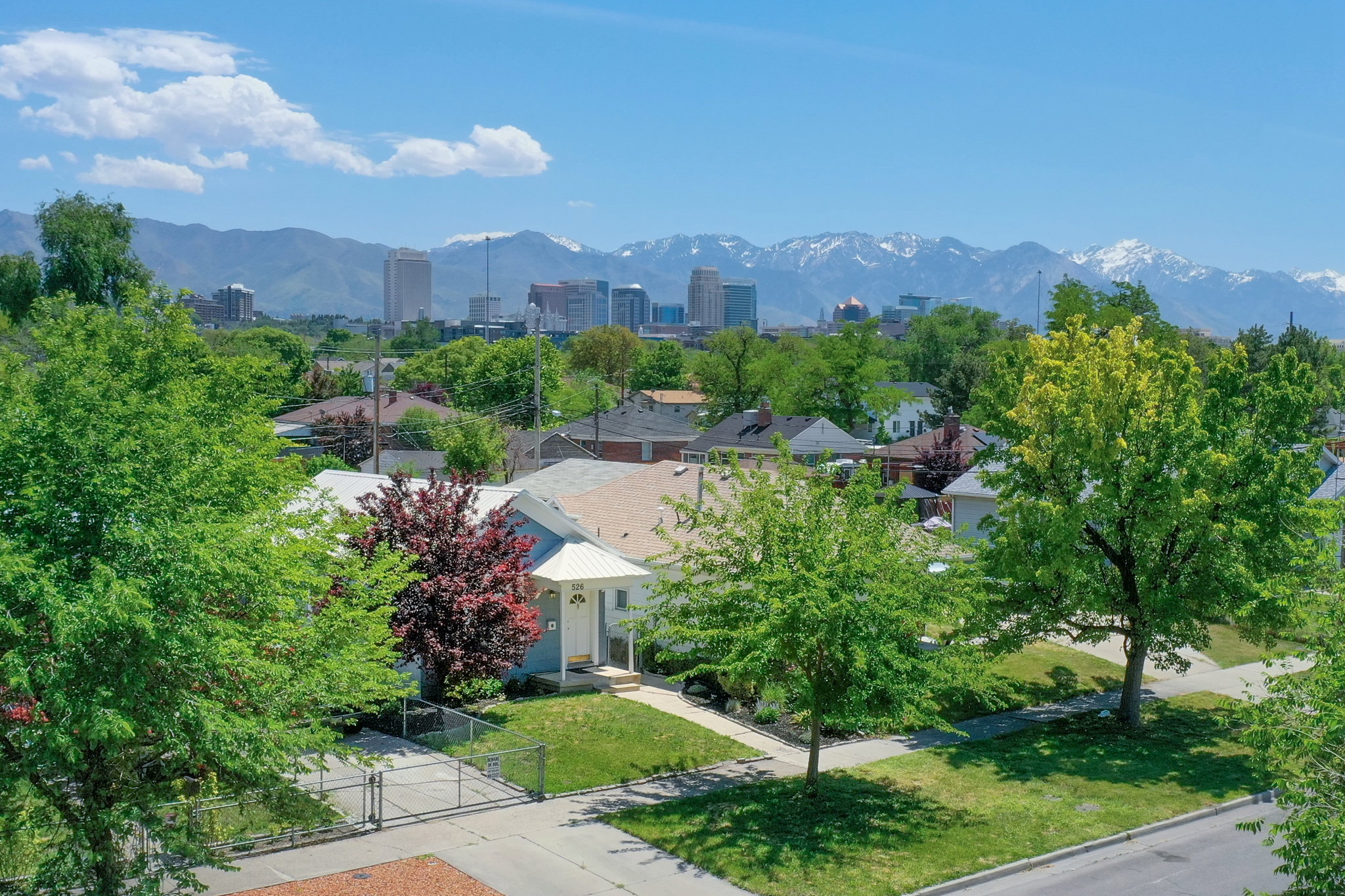 Downtown skyline and snow-capped mountain backdrop