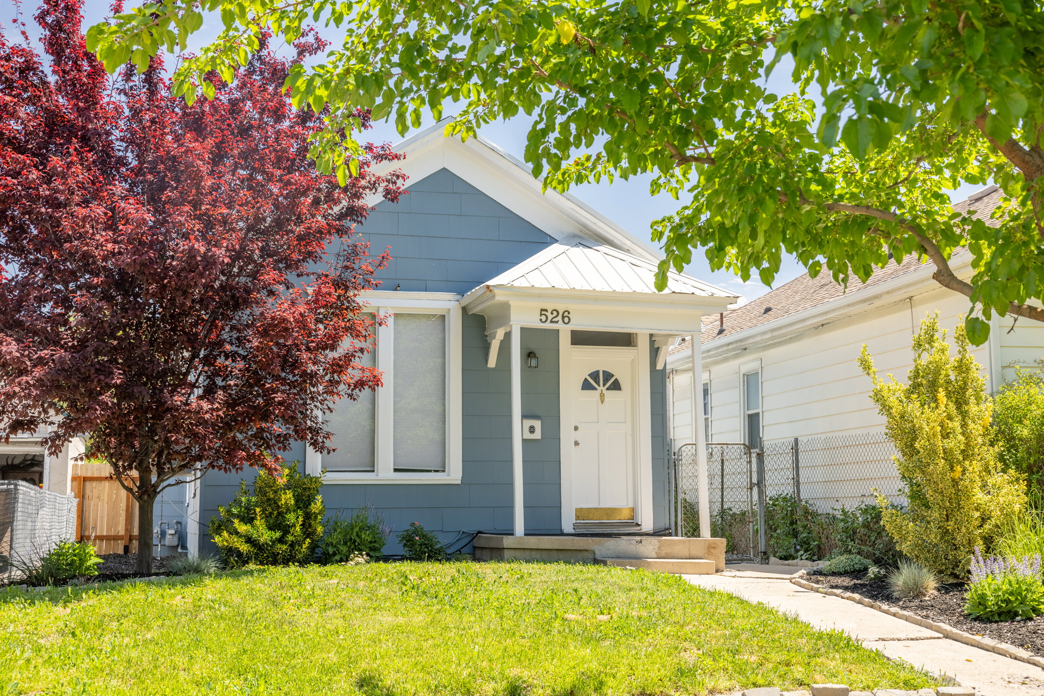 Light blue clapboard siding with white trim