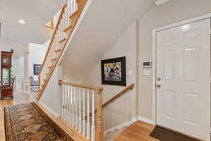 Hallway leading to basement and garage