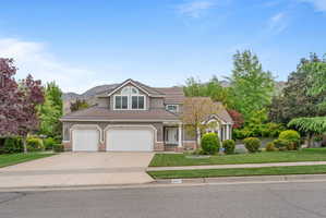 Stucco exterior with brick trim and bartile roof