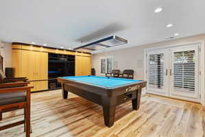 Recreation room with double French doors walks out to back patio