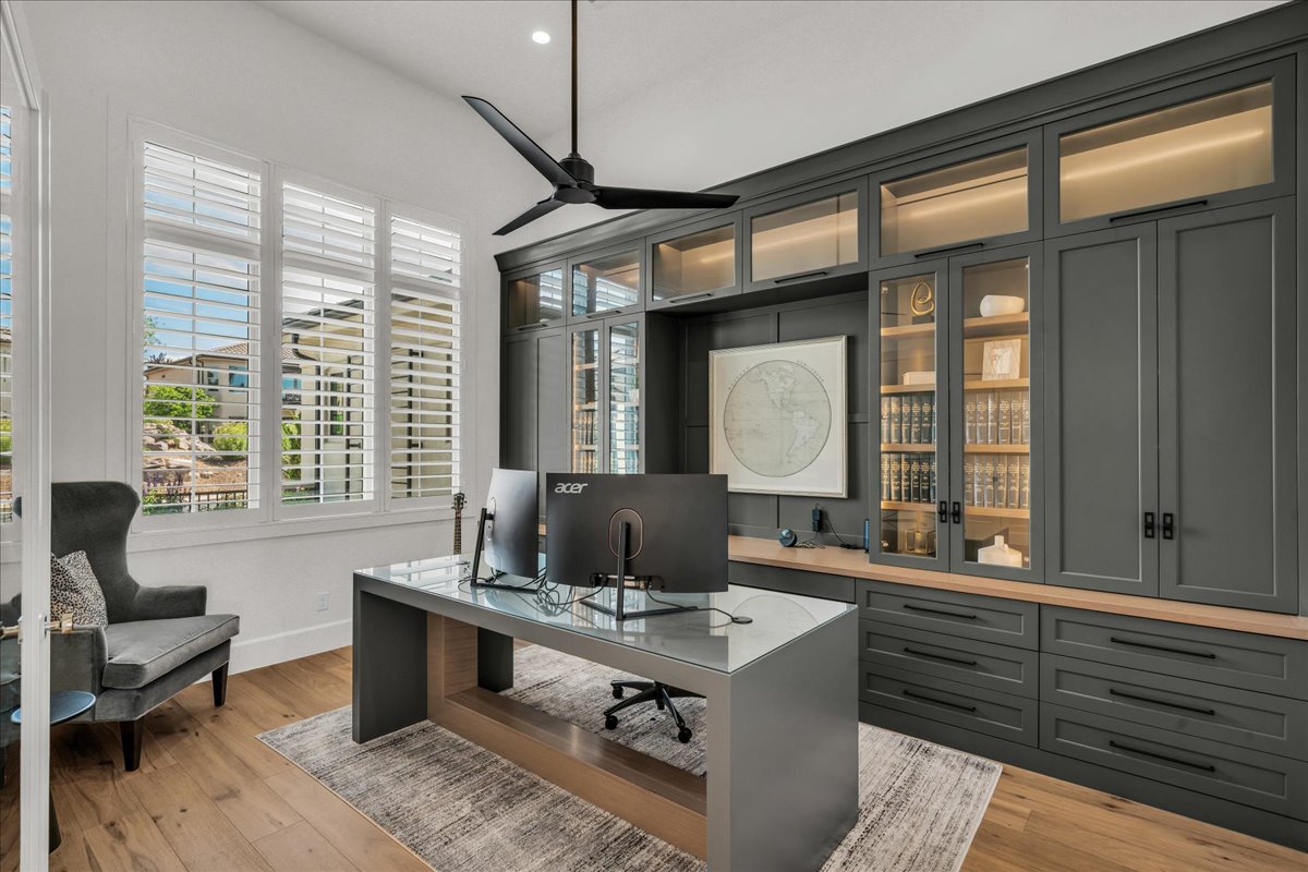 Custom built-in cabinetry with integrated lighting and glass-front doors