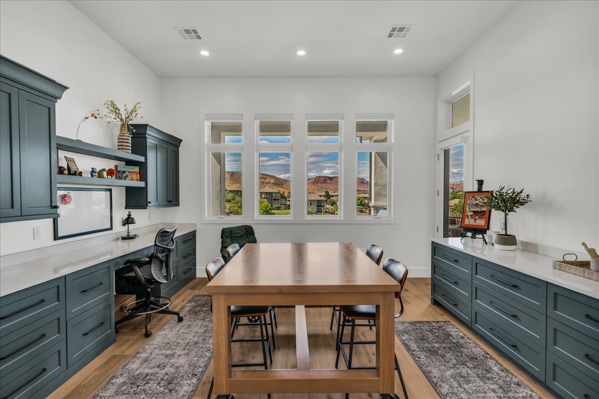 Art/Craft room featuring white walls and wood flooring